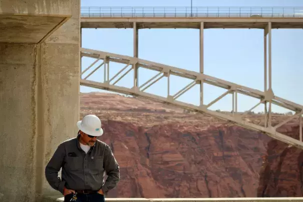 Bob Martin, who manages hydropower at Glen Canyon Dam, is grappling with the reality that generators could soon be shut off because of low water levels in Lake Powell. The Colorado River faces a growing supply-demand imbalance, and normal operations at the dam may suffer. (Credit: Alex Hager/KUNC)