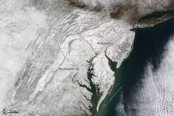 Nicknamed “snowpocalypse” and “snowmageddon,” an exceptionally severe winter storm dropped several feet of snow around the Washington, D.C., area in early February 2010. Image: NASA