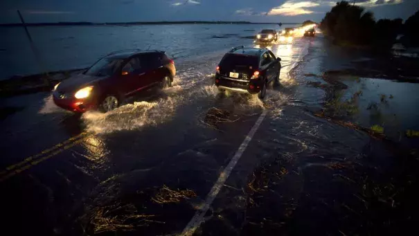 A perigean spring tide floods Highway 80, the only road to Tybee Island, Ga., June 4, 2016. Photo: Stephen B. Morton/The New York Times