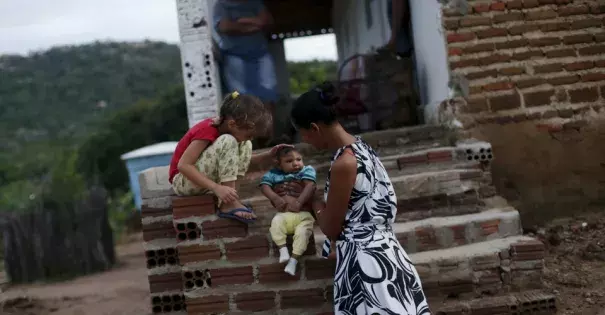 Miriam Araujo holds her son Lucas, who was born with microcephaly, in Sao Jose dos Cordeiros, Brazil. Photo: Ricardo Moraes, Reuters