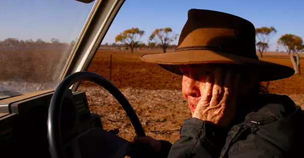 May McKeown, an Australian farmer, drives her truck to feed the remaining cattle on her drought-affected property in July. Photo: David Gray, Reuters