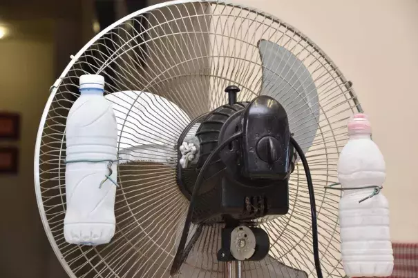 Ice in front of a fan to keep cool. Photo: Getty Images