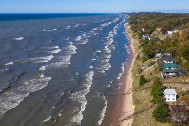 Lake Michigan waves batter the shoreline and cause erosion along North Shore Estates Road in Ferrysburg, Mich., on Oct. 23. Credit: Cory Morse, The Grand Rapids Press, AP