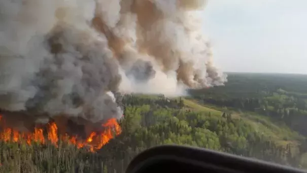 An aerial view of the flames roaring north of Fort McMurray on Tuesday afternoon. Photo: CBC News
