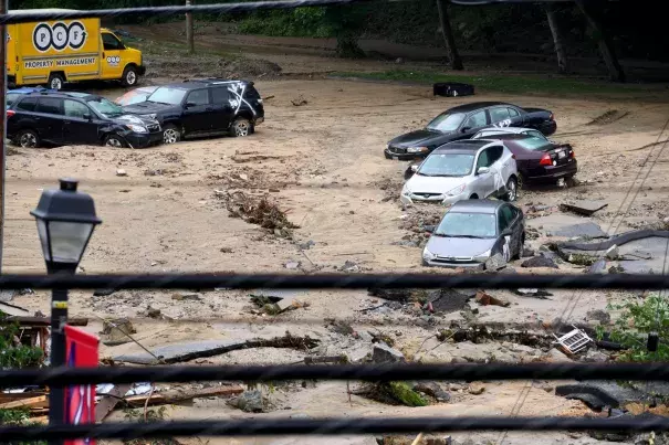 Destroyed parked cars are stranded in the mud May 28 in Ellicott City, Md. This comes two years after another flash flood killed two people and devastated the historic downtown. Photo: Katherine Frey, The Washington Post