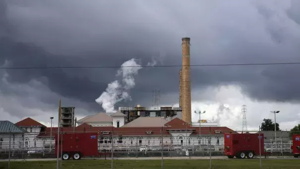 Rain clouds gather over the New Orleans Sewerage & Water Board facility, where turbines that power pumps have failed, in New Orleans, Thursday, Aug. 10, 2017. Photo: Gerald Herbert, Associated Press