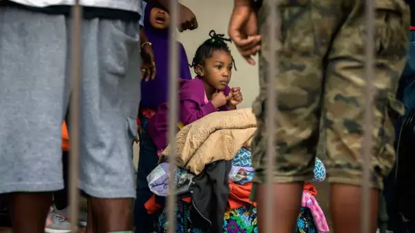 An unidentified little girl waits with her family at the Savannah Civic Center to evacuate from he path of Hurricane Irma, Saturday, Sept., 9, 2017 in Savannah, Ga. Photo: Stephen B. Morton, AP