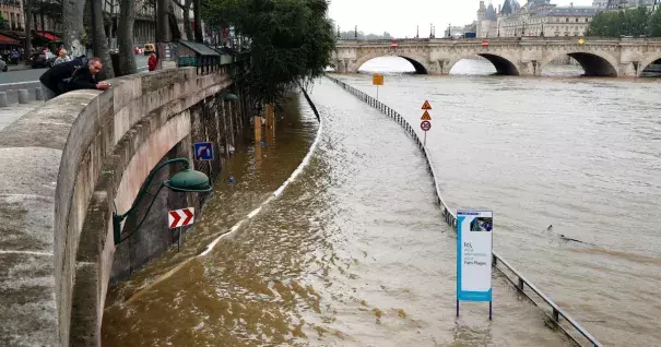 A man watches the flooded expressway along the Seine near the Pont Neuf (rear) after its banks became flooded, following heavy rainfalls on June 1, 2016 in Paris. Photo: Francois Guillot, AFP, Getty Images