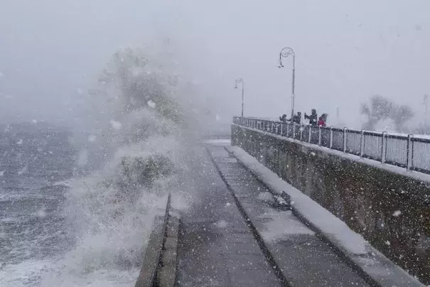 People watch as waves crash over the seawall along Lynn Shore Drive as Stella bears down on Lynn, MA, on Tuesday, March 14, 2017. Photo: Scott Eisen, Getty Images