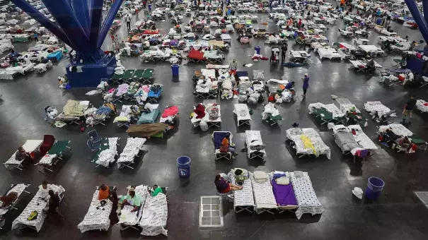 Evacuees fill up cots at a shelter set up inside the George R. Brown Convention Center in Houston, Texas. Photo: Joe Raedle, Getty Images