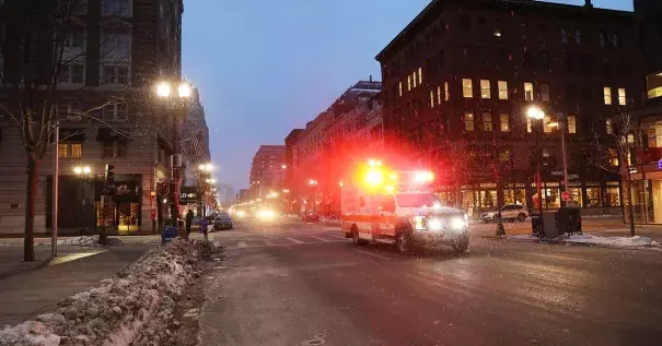 An ambulance drives through Boston as the snow begins to fall during a massive winter storm on January 4, 2018. Photo: Spencer Platt, Getty Images