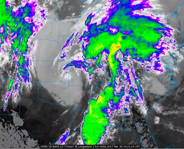 A GOES-16 infrared satellite image from 11:21 am CDT Thursday, March 30, 2017, shows the upper-level low centered near the KS/MO border, with extensive clouds and thunderstorms stretching ahead of it from the Great Lakes to the Gulf of Mexico. A small pocket of relatively clear air may allow for storm redevelopment on Thursday afternoon over the lower Ohio Valley. GOES-16 data are preliminary, non-operational, and still being tested. Image: NEXLAB/College of Dupage