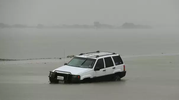 A car is partially submerged after Harvey hit Corpus Christi. Photo: Mark Ralston, AFP/Getty Images