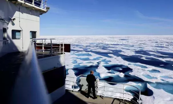 Canadian Coast Guard Capt. Victor Gronmyr looks out over the ice covering the Victoria Strait as the Finnish icebreaker MSV Nordica traverses the Northwest Passage through the Canadian Arctic Archipelago on July 22, 2017. Photo: David Goldman, AP