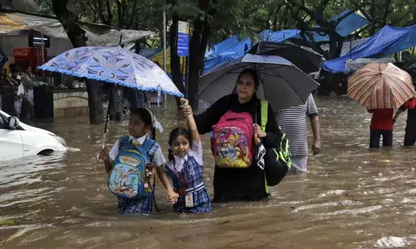 A Mumbai street after flooding that left more than 20 people dead. Photo: Rajanish Kakade, AP