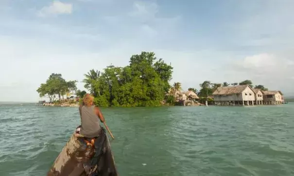 At high tide, Lau Lagoon's manmade islands barely rise above the waterline. During king tides and
strong winds, which are becoming increasingly frequent, some islands are now completely submerged. Photo: Beni Knight