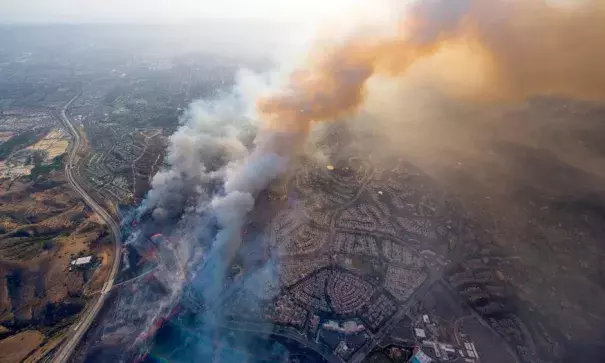 Wildfires, fanned by high winds, threatened homes in Tustin, Calif., this week. Photo: Cindy Yamanaka, The Orange County Register via AP