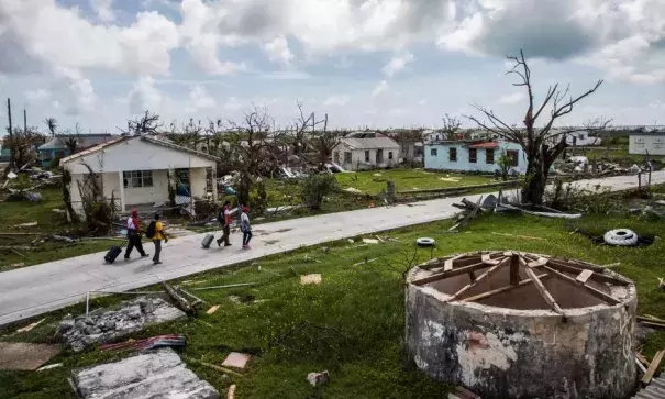 Residents of Codrington and Red Cross workers survey damage on the island of Barbuda in the aftermath of Hurricane Irma. Photo: Salwan Georges, Getty Images
