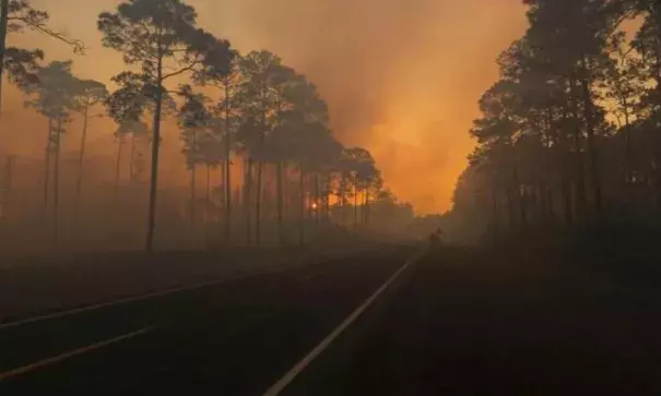 Smoke is seen during sunset as the West Mims fire burns in the Okefenokee National Wildlife Refuge in a photo released April 29, 2017. Photo: Mark Davis, Fish and Wildlife Service/Handout via Reuters