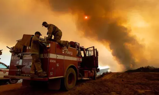 Firefighter Joe Smith retrieves supplies while battling the Ranch Fire, part of the Mendocino Complex Fire, burning along High Valley Rd near Clearlake Oaks, California, on August 5, 2018. Photo: Noah Berger, AFP/Getty Images