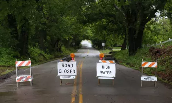 High water signs block a flooded stretch of 81st Street near Elwood Avenue in Jenks, Okla., on Saturday, April 29th, 2017. Photo: Matt Barnard, Tulsa World