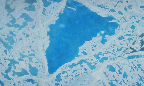 A large pool of meltwater over sea ice in the Beaufort Sea. Photo: NASA, Operation IceBridge