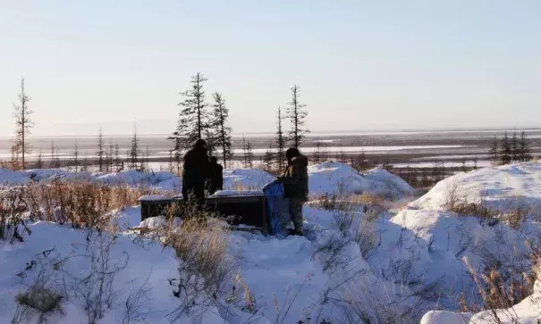 In this Oct. 27, 2010 file photo, Russian scientists Sergey Zimov and his son Nikita Zimov extract air samples from frozen soil near the town of Chersky in Siberia 6,600 kms (4,000 miles) east of Moscow, Russia. Photo: Arthur Max, Associated Press