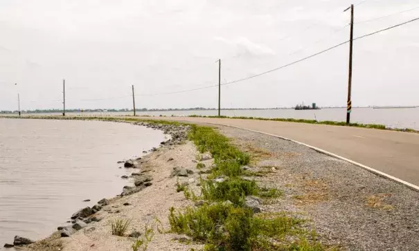 When tides are high and winds are blowing, Island Road sometimes becomes impassable. Isle de Jean Charles is vulnerable to hurricanes and flooding. The marsh is disappearing and seas are rising because of global warming. Photo: William Widmer, Redux for CNN