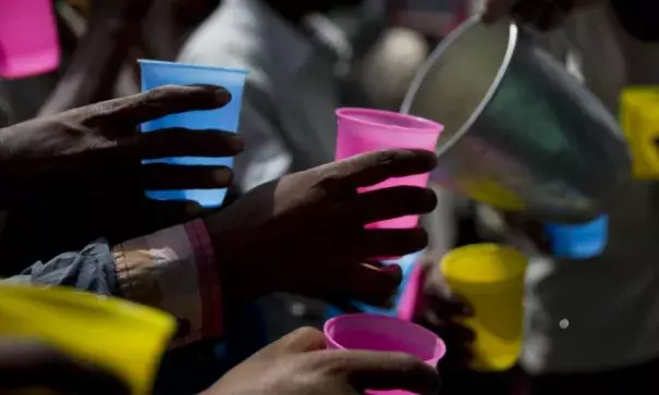 Indians reach to get a cold drink distributed by a roadside on hot summer day in New Delhi, India, Monday, June 5, 2017. Photo: Tsering Topgyal, AP