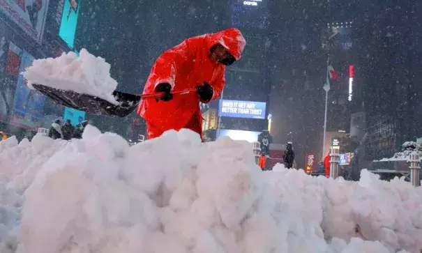 A worker clears snow in Times Square in New York City, on March 14, 2017. Photo: Andrew Kelly, Reuters