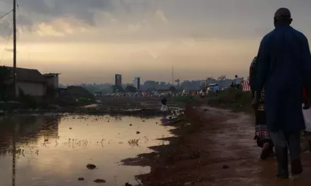 Settlements along drainage pathways often causes flooding and stagnant water along walkways. These large pools of water increase the risk of diseases such as malaria and cholera. Photo: E. Paulat, VOA