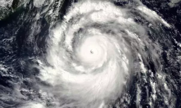 A September 13, 2016 NASA satellite omage shows Super Typhoon Meranti. Taiwan braced for the approaching super typhoon by evacuating nearly 1,800 tourists from offshore islands and closing some schools and offices. Meranti is expected to skirt past the island's southern tip, bringing torrential rain and powerful winds late Tuesday, the Central Weather Bureau said. Photo: HO, AFP, Getty Images