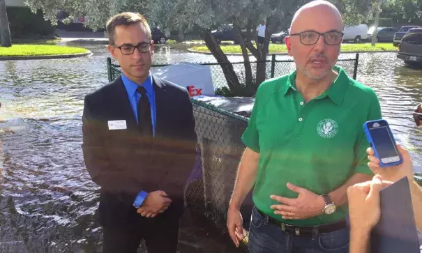 U.S. Representative Ted Deutch wades through tidal flooding in Fort Lauderdale on Oct. 17, 2016. Photo: Peter Haden, WLRN