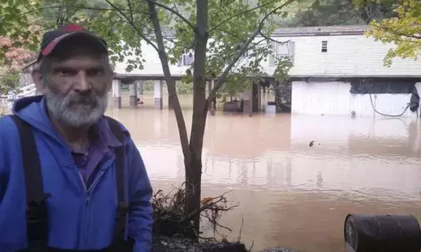 Sheb Brown, o fTrout Run, Pa., stands behind his elevated home on McIntyre Way, as flood waters surround it Friday morning, OCt. 21, 2016. Freak storms packing up to 100 mph winds hit Pennsylvania early Friday, sending floodwaters into hundreds of homes and causing a pipeline rupture that dumped more than 50,000 gallons of gasoline into a stream, threatening drinking water supplies. Photo: Philip A. Holmes, Sun-Gazette via AP
