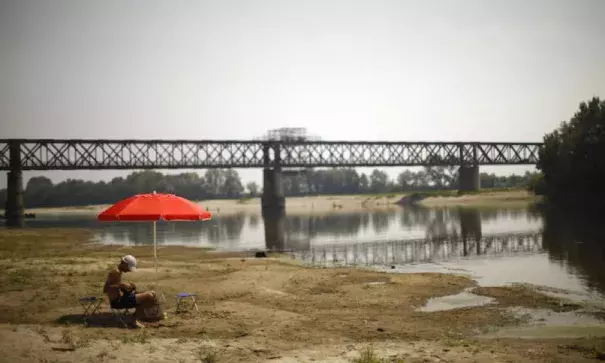 A car tire lies on a dry sandbank near the Po River near the Ponte della Becca bridge in Linarolo, near Pavia, northern Italy, on Tuesday, August 1, 2017. Italy is in the grip of its worst drought in decades. Photo: Marco Bertorello, AFP, Getty Images