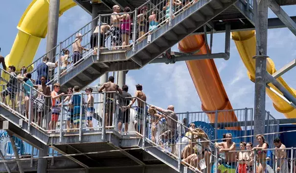 People looking to beat the heat ascend a water slide stairway at Knott's Soak City in Buena Park, Calif., on Friday, July 7, 2017. Los Angeles tied their record high for the date, 96°. Photo: Leonard Ortiz, The Orange County Register via AP