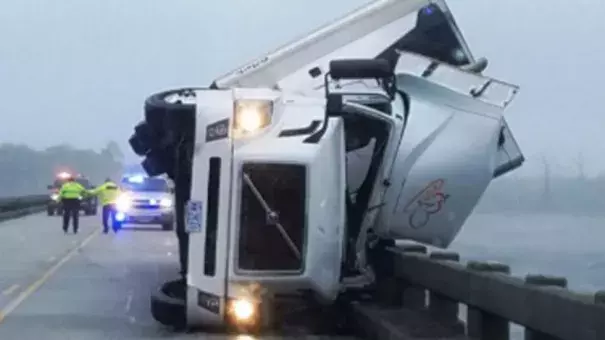 A man was killed Saturday after his tractor-trailer overturned because of high winds on the Lindsay C. Warren Bridge east of Columbia, North Carolina. Photo:  Tyrrell County Sheriff's Office