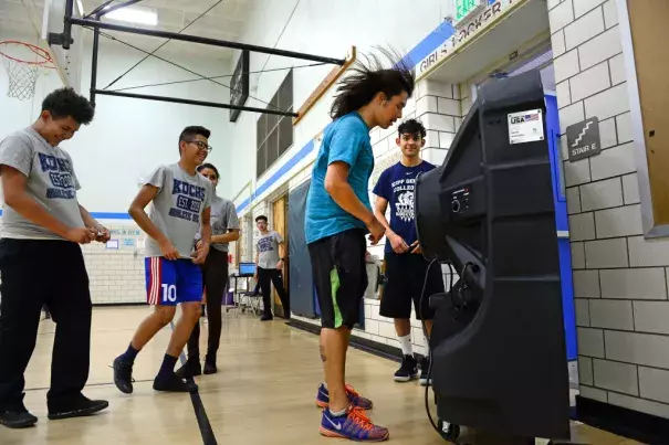 Gym teacher Neal Finch cools off in front of a large Portacool Cooling system set up to help cool off the gym during classes at KIPP Denver Collegiate High School on Sept. 24, 2018 in Denver. Photo: Helen H. Richardson, The Denver Post