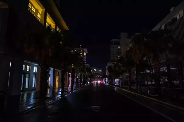 Street lamps are out on a street in the Condado community of Santurce in San Juan, Puerto Rico, on Sept. 19, 2022, after the passage of Hurricane Fiona. (Credit: AFP via Getty Images)