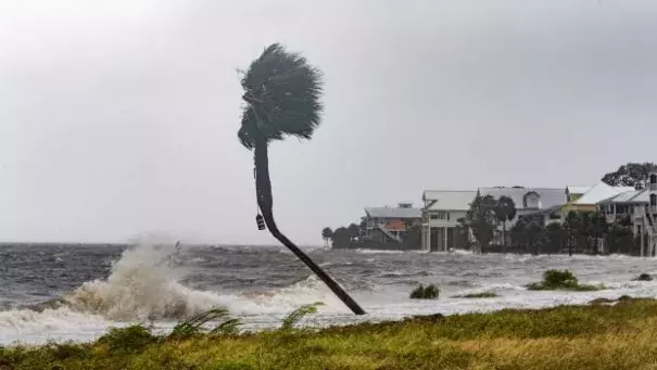 The storm surge and waves from Hurricane Michael are shown near beachfront homes on Wednesday in the Florida Panhandle community of Shell Point Beach. Photo: Mark Wallheiser, Getty Images