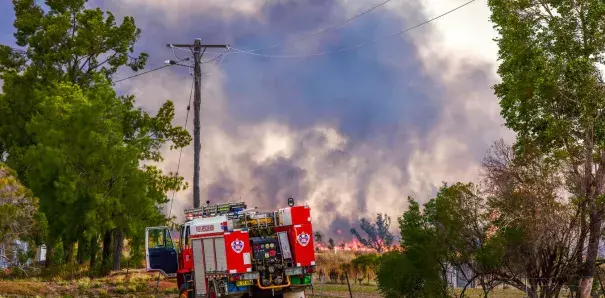 Emergency crews tackle a bushfire at Boggabri, one of dozens across NSW during the heatwave. Photo: Karen Hodge, AAP