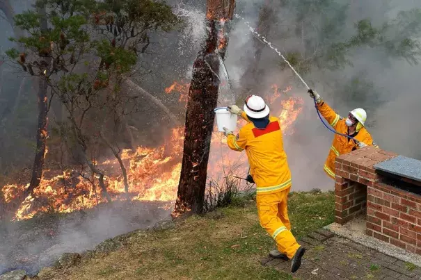 Firefighters deliberately merged two major blazes to manage the advancing infernos. Photo: William West, AFP, Getty Images
