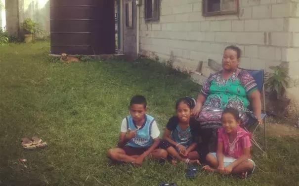 Rusina Rusin on April 16, 2015, with her grandchildren, including Keslynna Myo Sibok, right, at their home in the part of the Marshall Islands' Majuro Atoll that is most vulnerable to flooding.Photo: Renee Lewis, Al Jazeera