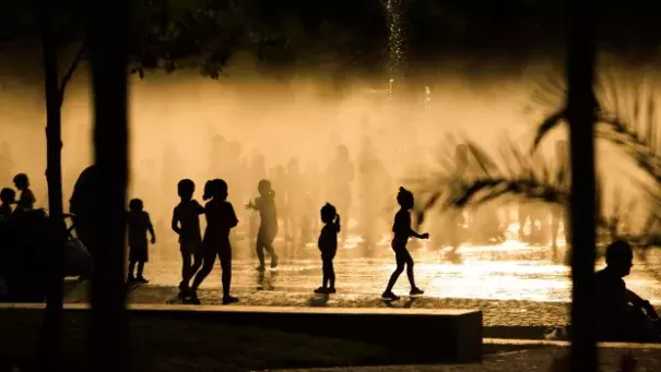 Children play as they cool down in a fountain beside the Manzanares river in Madrid, Spain. Photo: AP