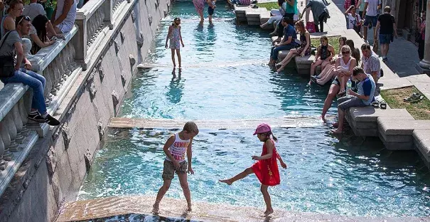 Children playing in a fountain near the Kremlin Wall in Moscow during a heat wave in 2014. Photo: Alexander Zemlianichenko, Associated Press