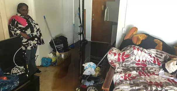 Debbie Williams of Wilmington, N.C., has to walk through a stagnant pool in her apartment. This is where she's been sleeping. Photo: Adam Aton, E&E News