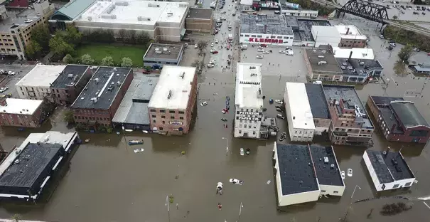 An aerial view of Davenport, Iowa, which remains flooded after a temporary levee broke. Credit: Facebook.com/QC DRONE, Newscom