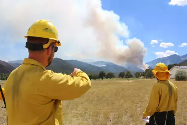 Public Information Officer Evan Burks watches how the Hayden Pass fire is moving on Thursday afternoon, July 14, 2016. Photo: Sarah Matott, Daily Record