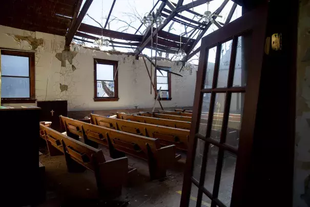Pews sit in the sanctuary of Redemption Missionary Baptist Church in Cedar Rapids after it was severely damaged during the Aug. 10, 2020, Iowa derecho. (Credit: Daniel Acker for The Washington Post)