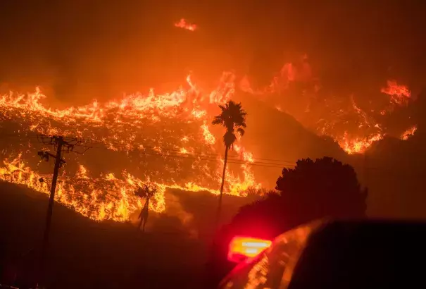 The Thomas Fire advances downhill into La Conchita, near Ojai and Carpinteria, Calif., on Dec. 7, 2017, fanned by strong Santa Ana winds overnight. (Credit: Stuart Palley/for The Washington Post)